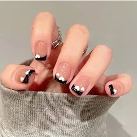 White Heart Tips on short black French tip nails