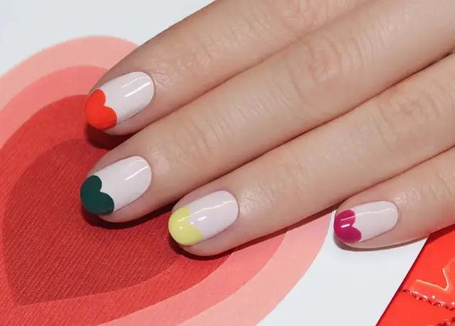 Hearted Rainbow french tip on short nails