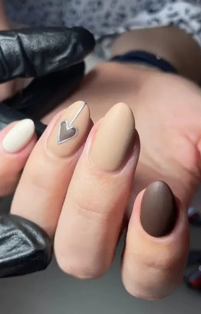 Matte brown heart nails