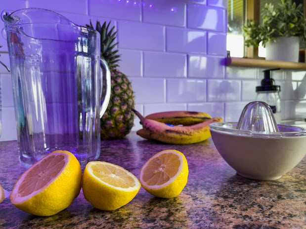 lemons and a juicer on a counter