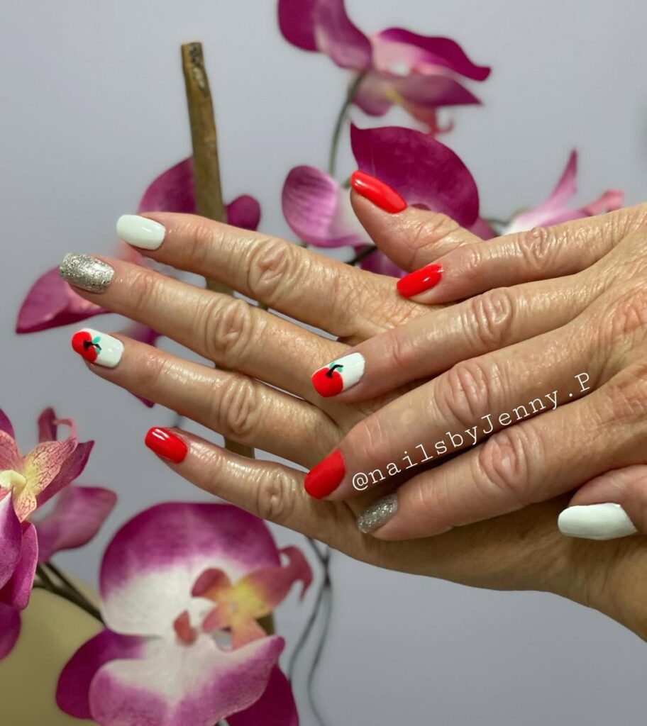 Red and white gel manicure with apple nail design