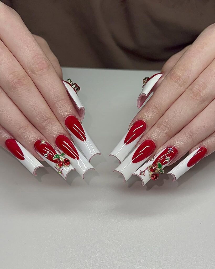 Red acrylic nails with white french tip and 3d cherries