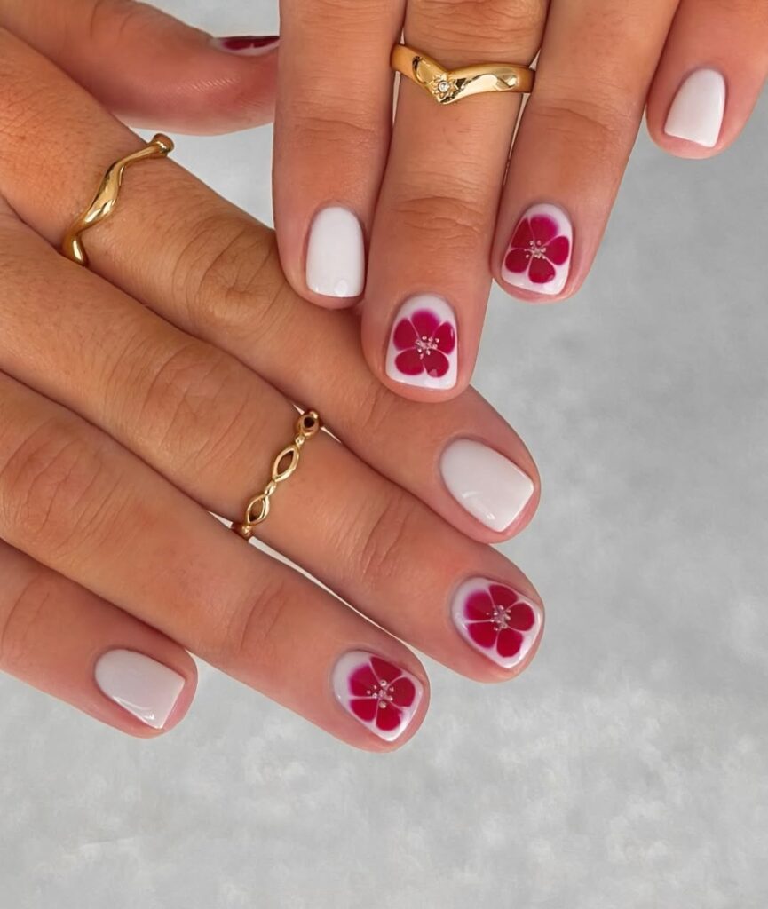 Short white nails with red flowers