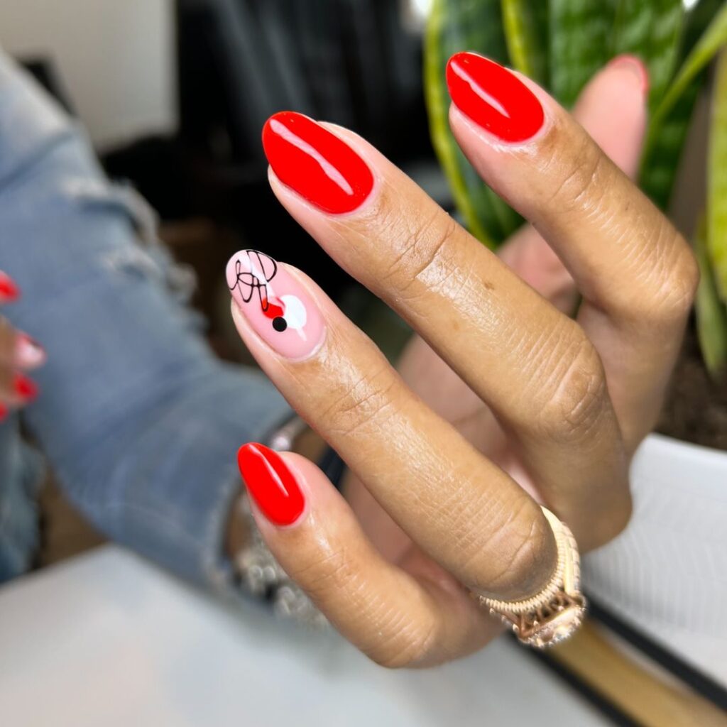 Red and black nails with yarn accent 