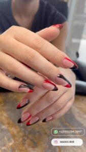 Red and black french tip nails like yin-yang