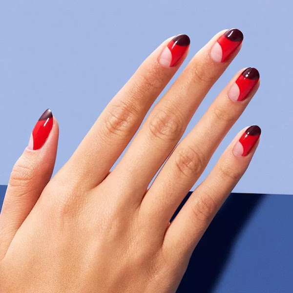 geometric Red and black half-moon nail design