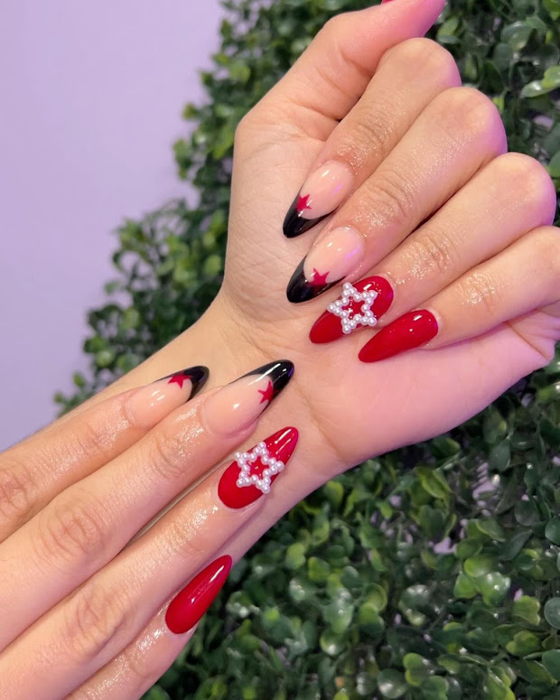 red nails with stars and black french tip