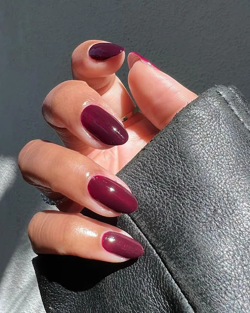 Burgundy nail polish on hands