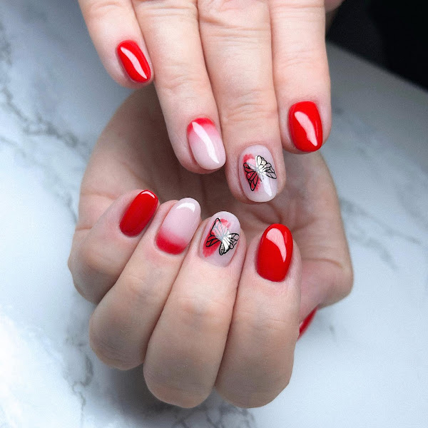 Nail art with red ombre and black butterfly