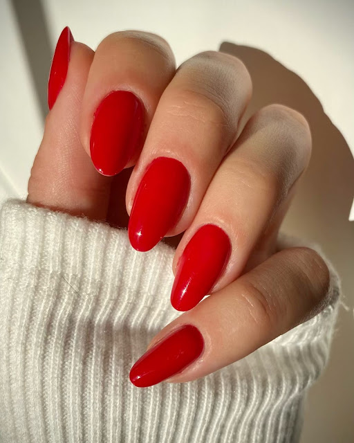 red nail polish on hands