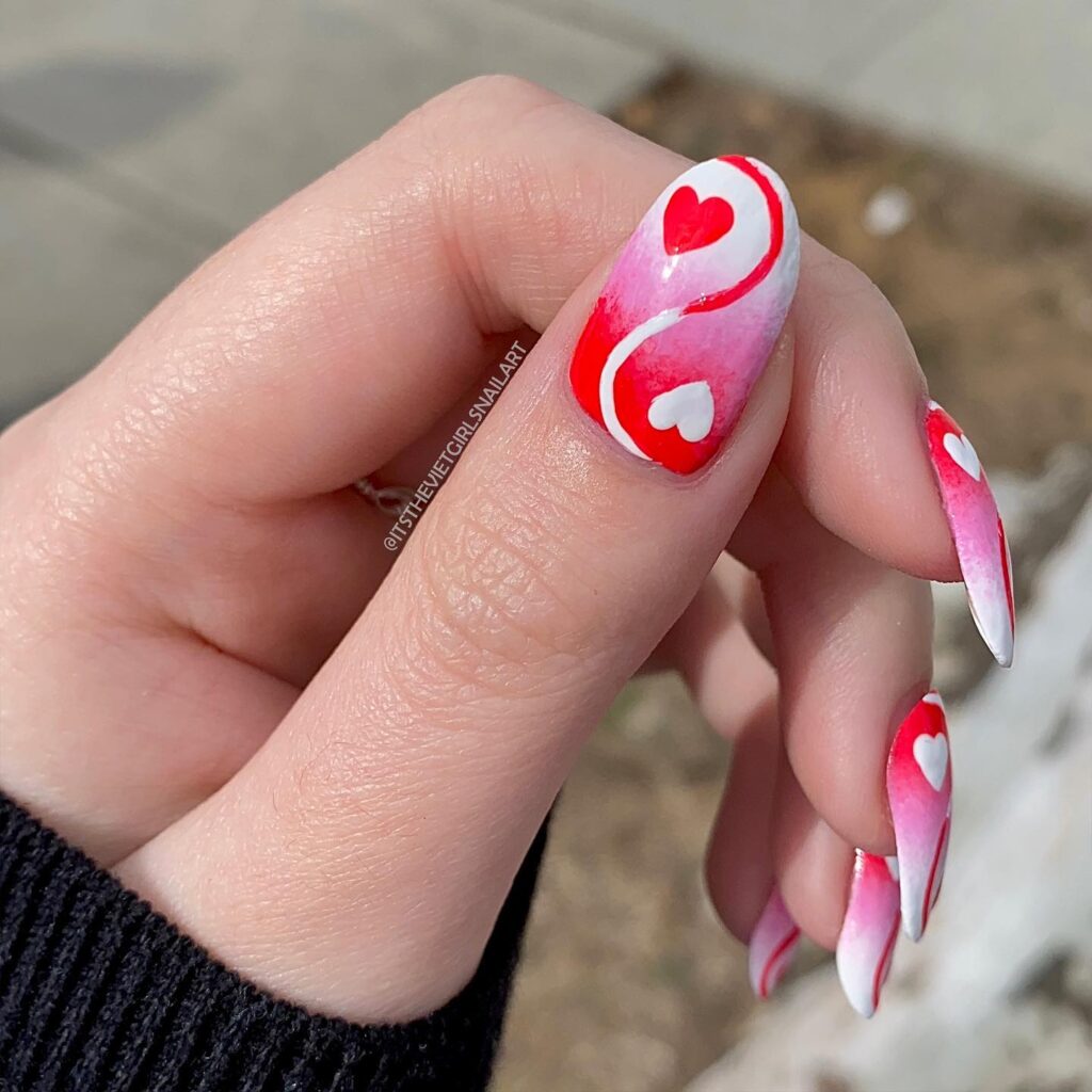 Red and pink yin yang nail art idea for romantic events