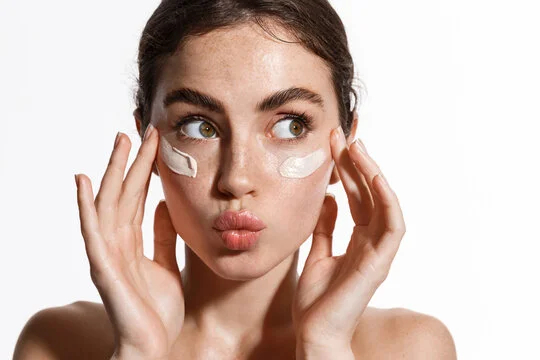 Women applying product on her face