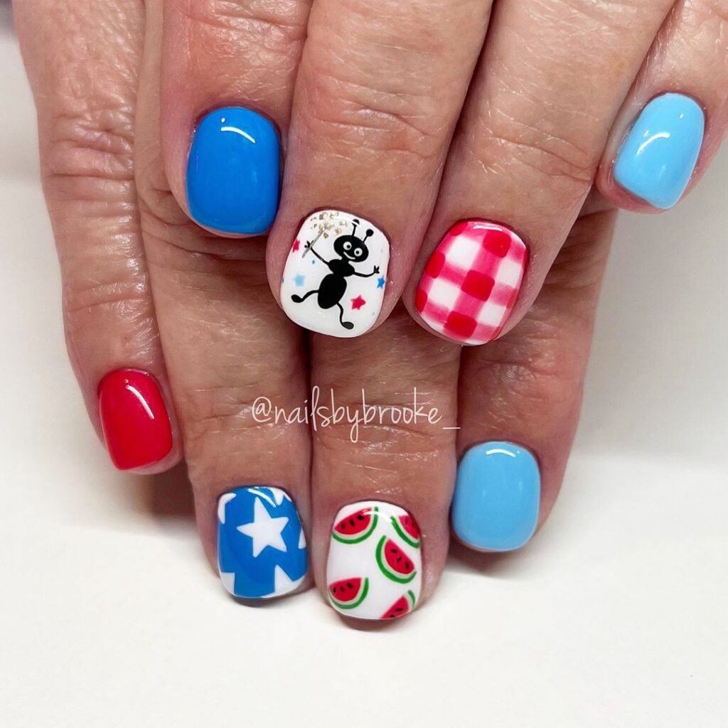 Nail art featuring 4th of July picnic vibe nails