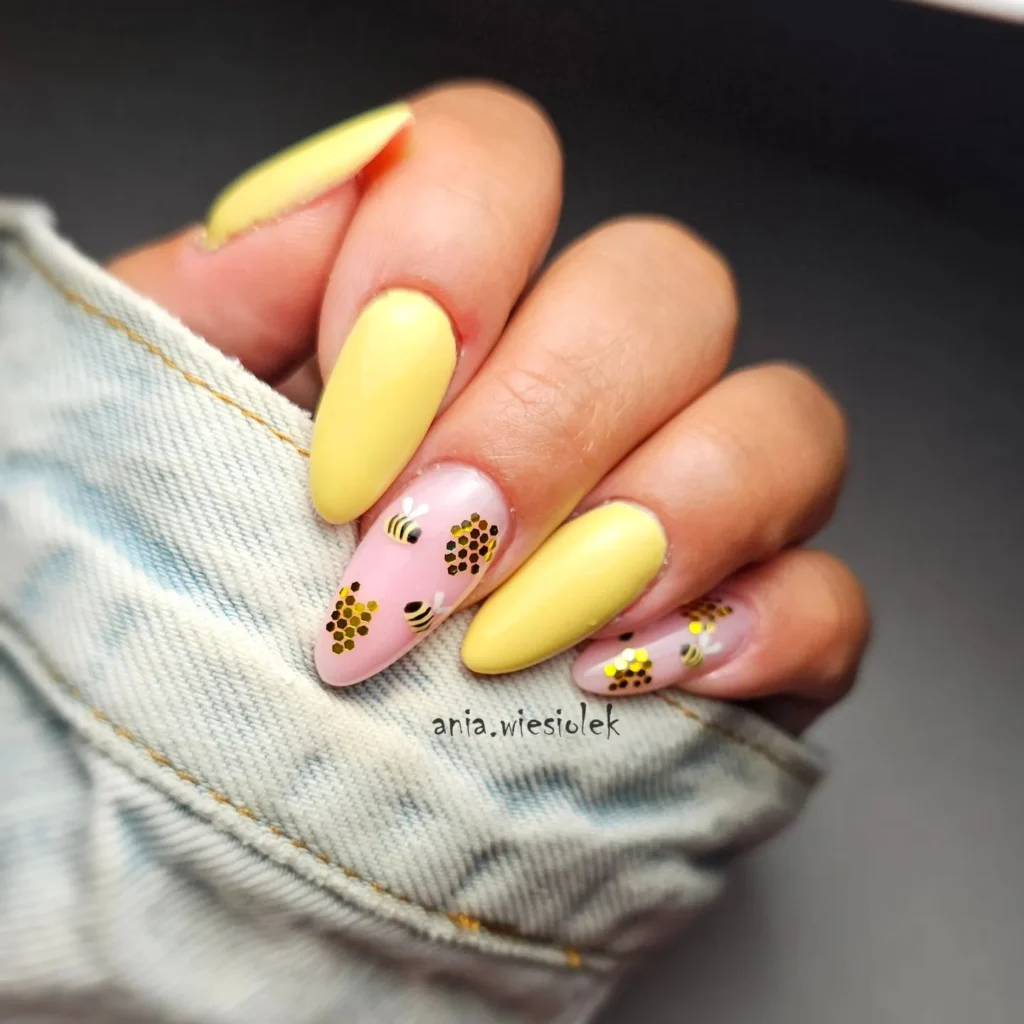 Bee nail art on almond-shaped nails