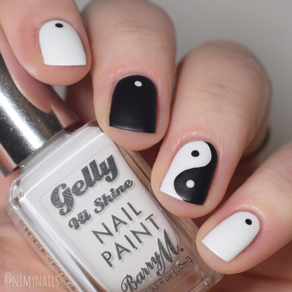 Image featuring black and white yin yang nail art 