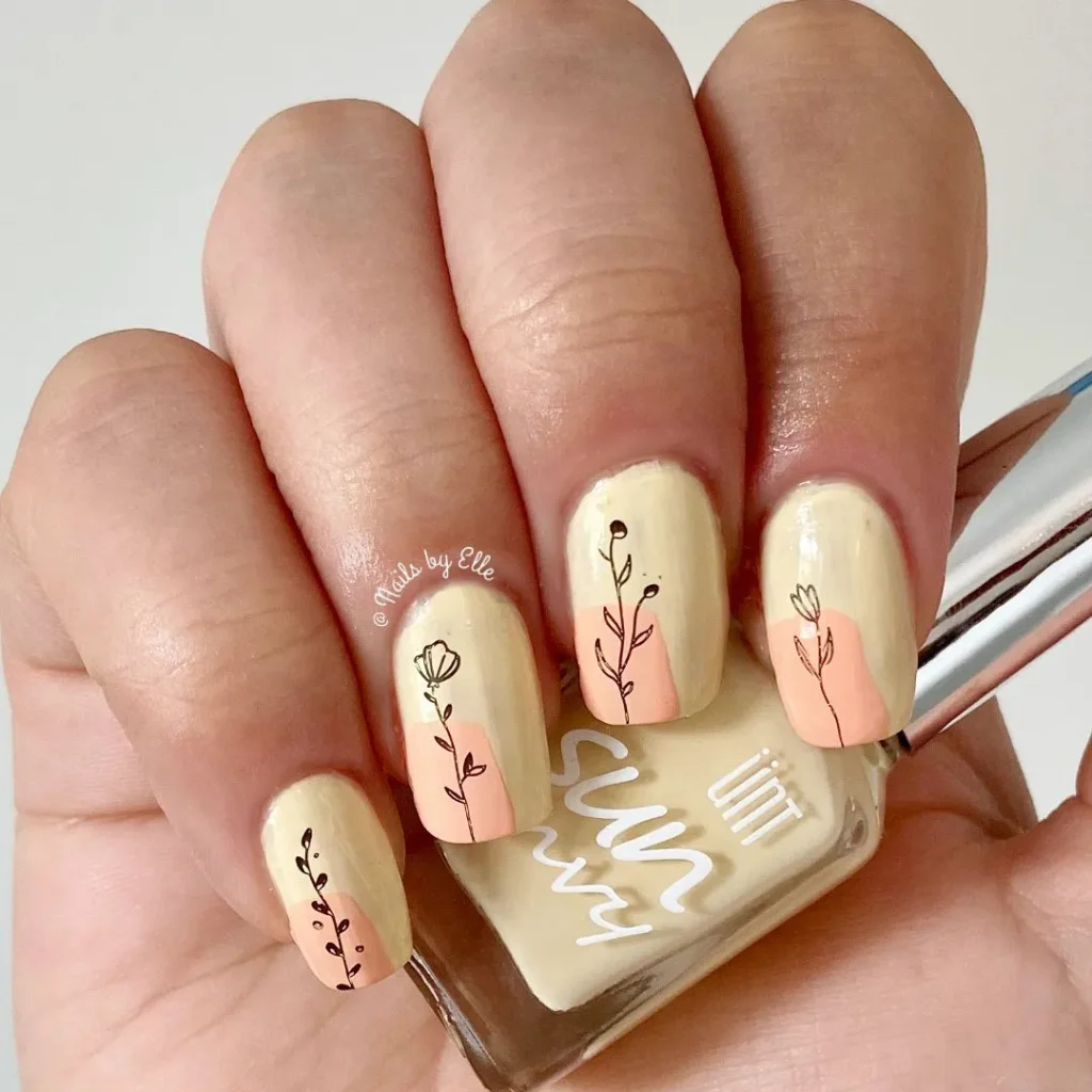 Floral design on yellow nails