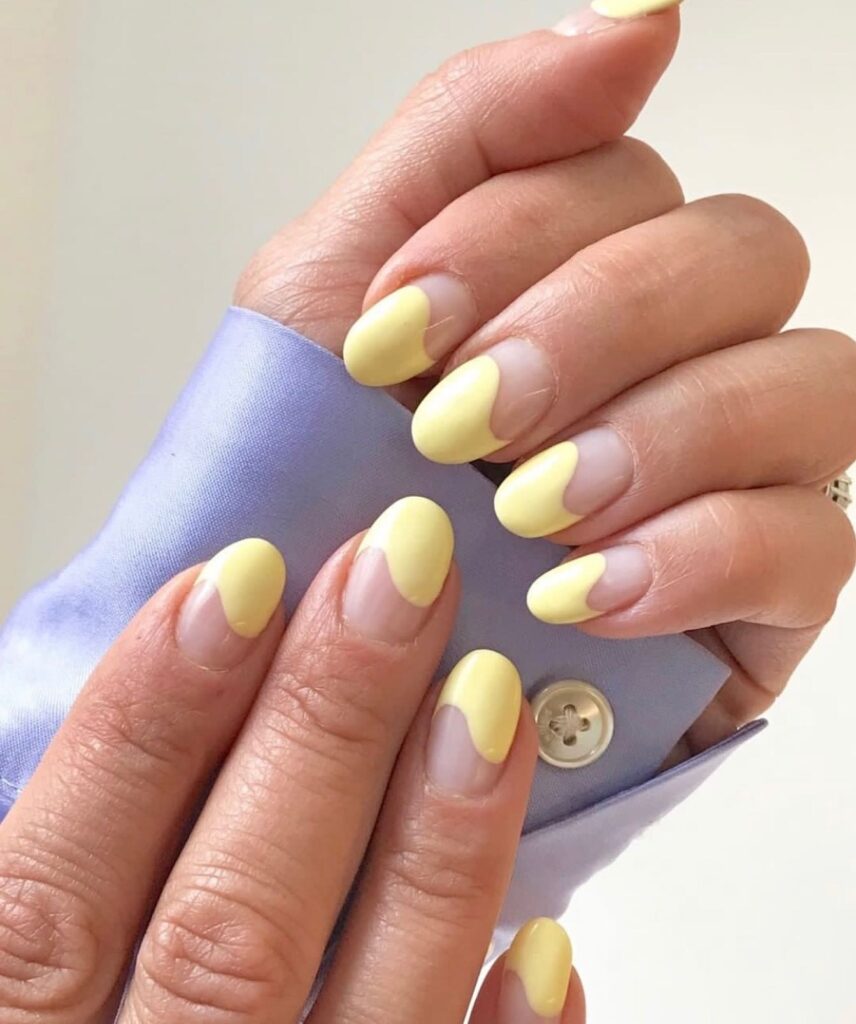 Yellow french manicure nails with a twist