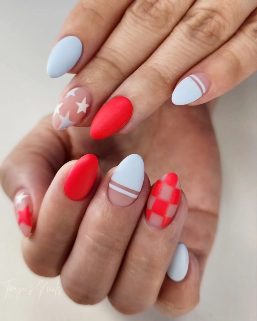 Matte red and white nails with stars and lines