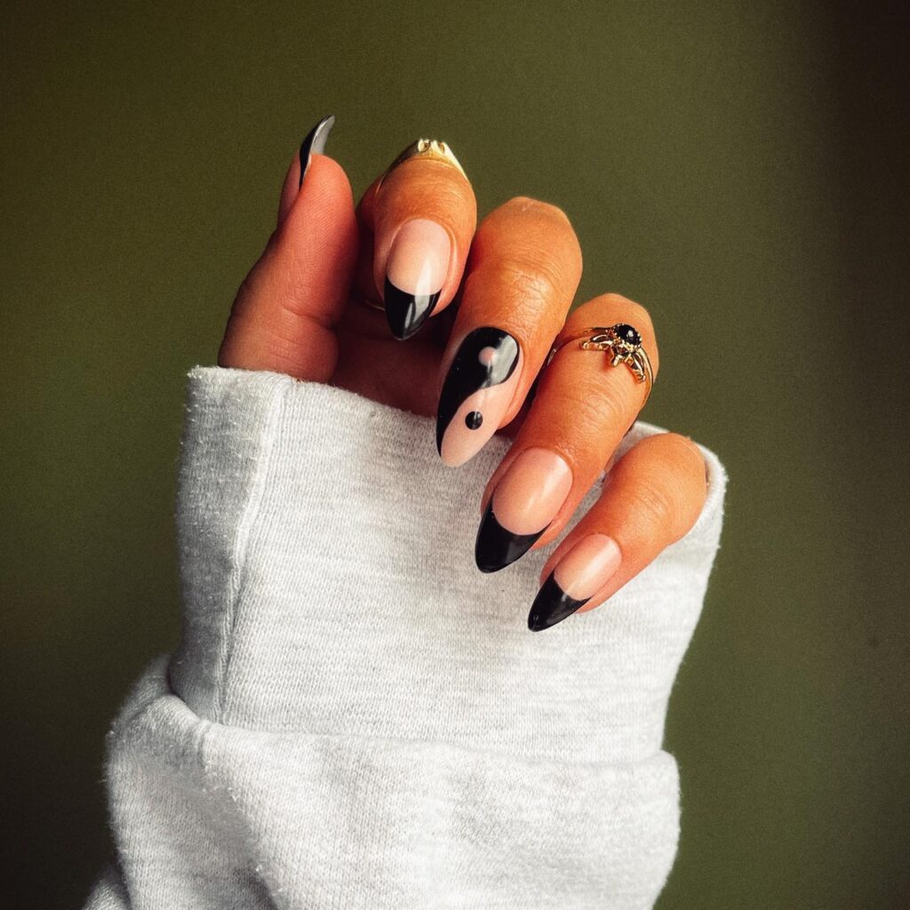 Negative space yin yang nail art in black color 