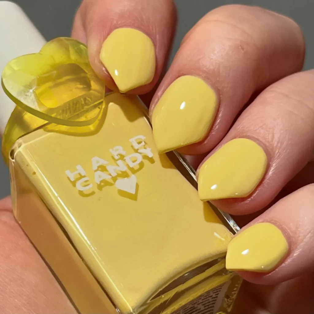 Pastel yellow nails with a unique shape