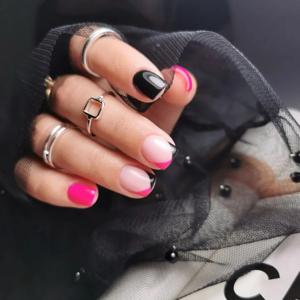 Short nail with french tip in bright pink and black color