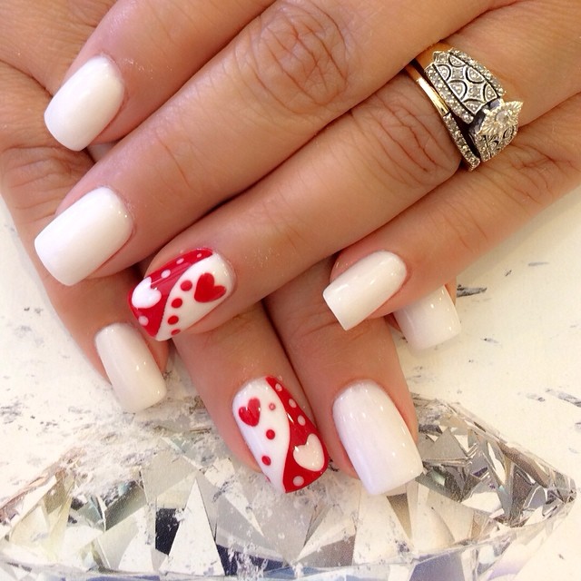 Red and white yin yang nails with hearts 