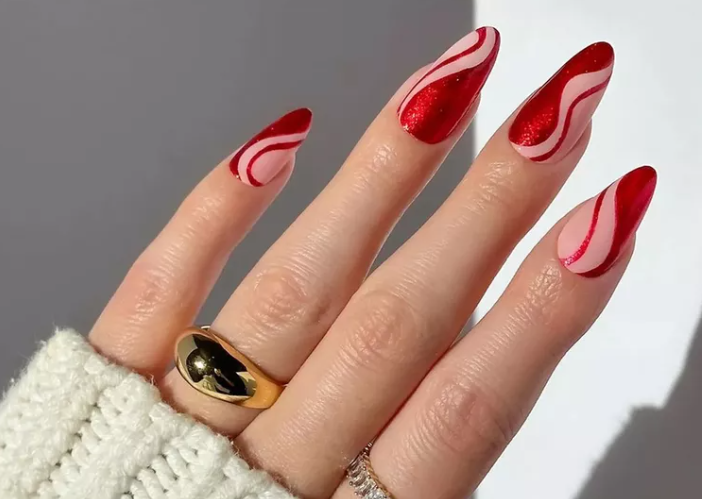 Red swirl nail design