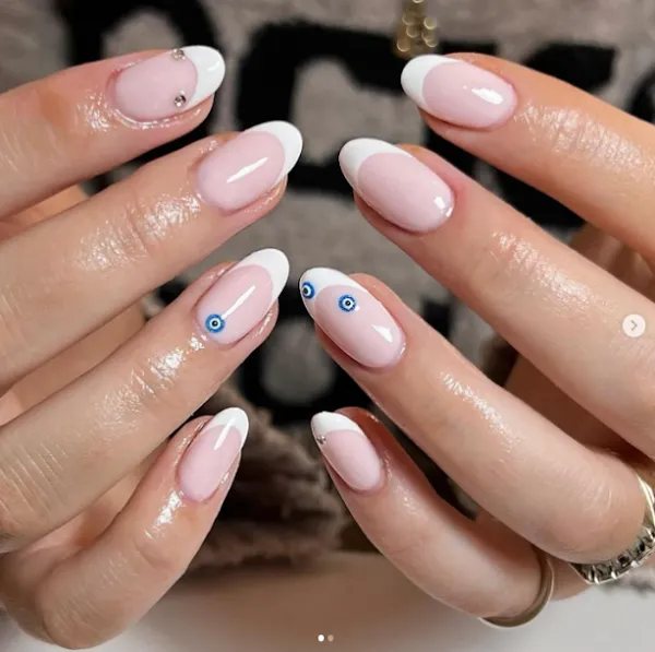 Classic french nail idea on short Nails with little blue eye