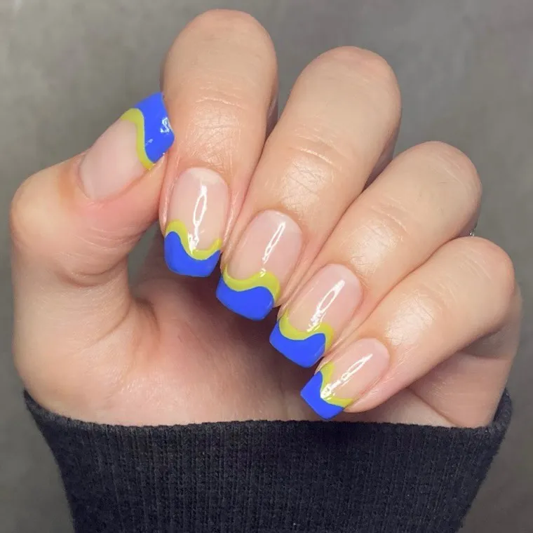 Bright blue and yellow wavy french tip nails