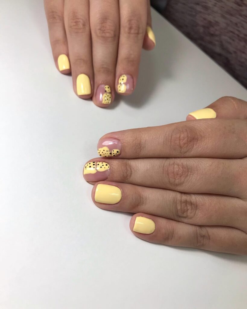 Yellow manicure for black girl