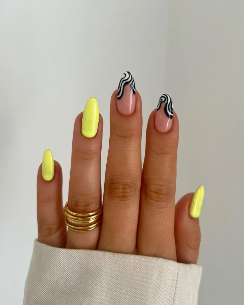 Macaroon yellow colour nails with zebra print