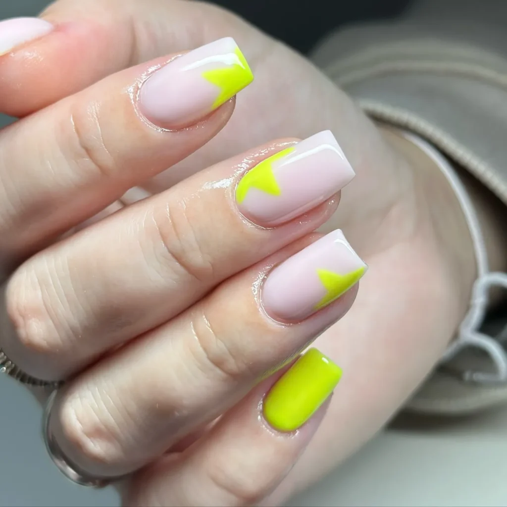 Bright neon yellow stars on nails