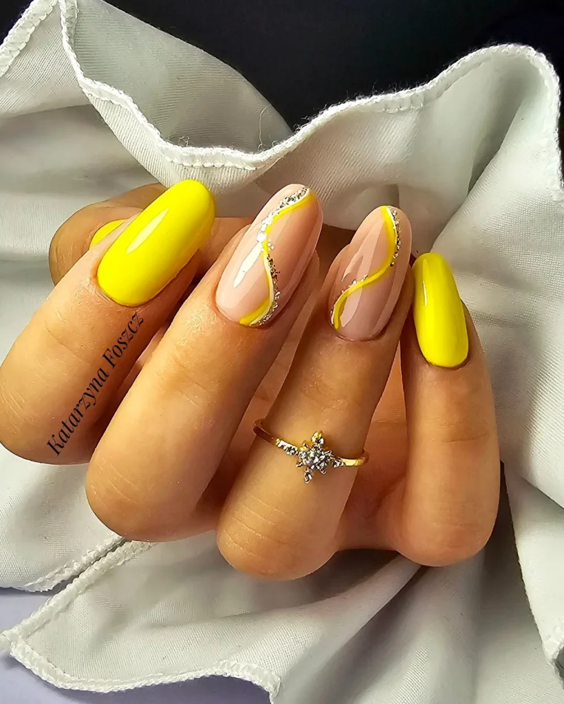 Energetic yellow nails along with glitter squiggle lines