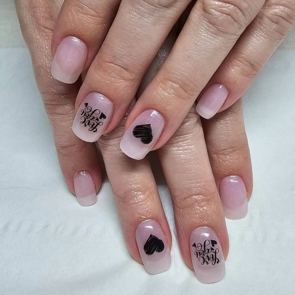 Negative spaces nails with black hearts