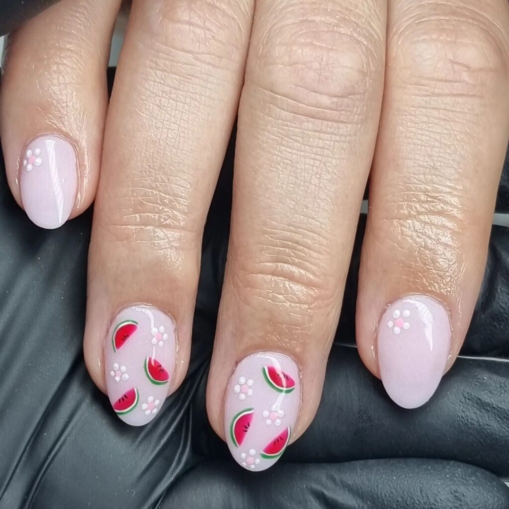 baby pink short nexgen nails with cute watermelon and flower accents