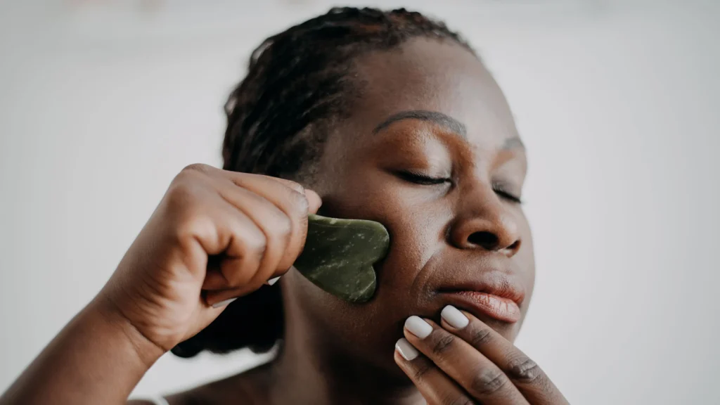 Women doing Gua Sha facial