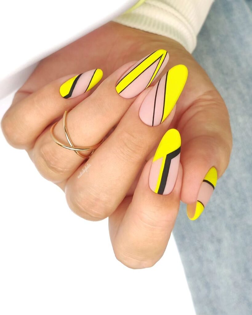 Yellow nail with black lines