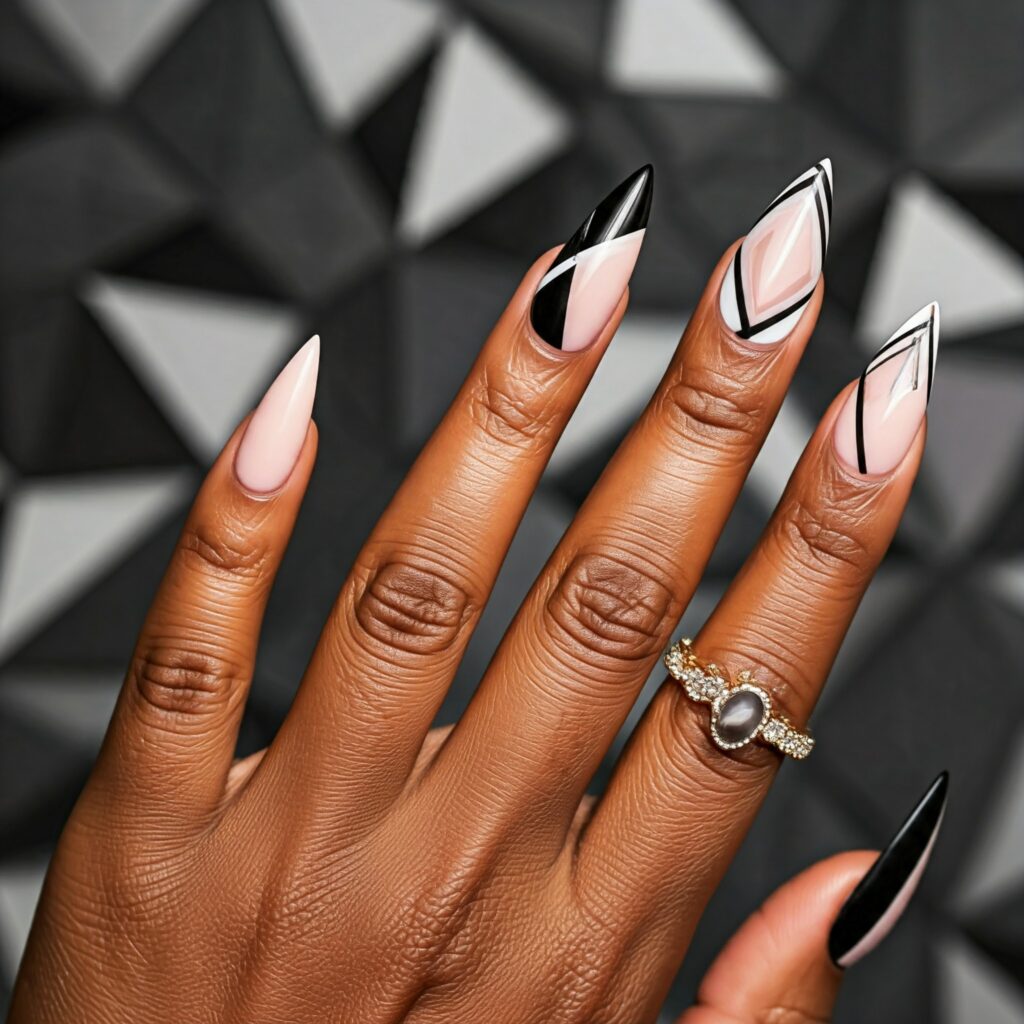 Geometric nail art on Sharp-tipped nails in black and white color