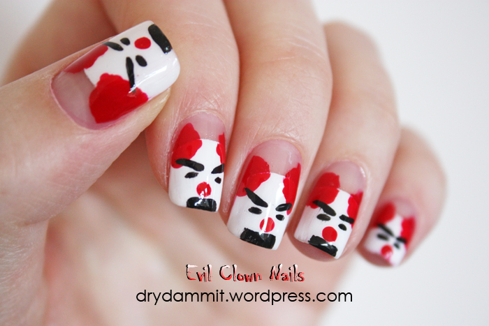 Red, white and black evil clown face manicure