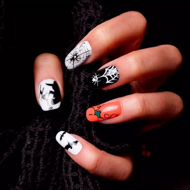 Orange and black nails with halloween inspired accents like bats, spiders, and witches