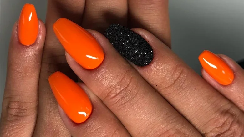 Classic orange and black nails with glitters