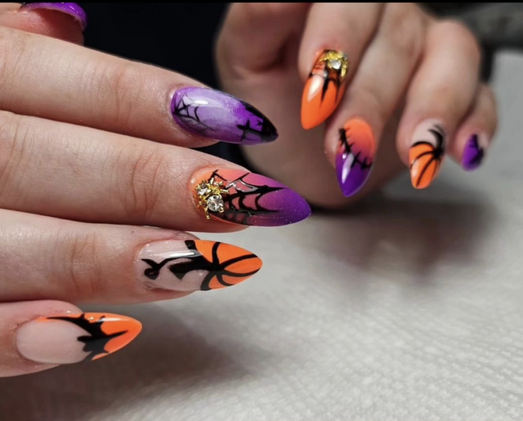 Orange and purple halloween spider web nails