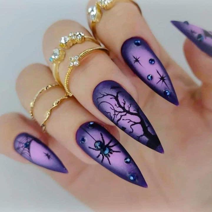 Purple and black aura nails with spider accent