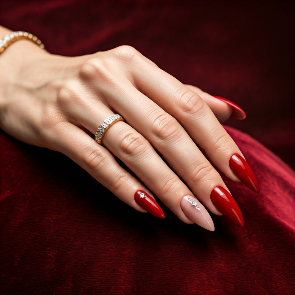 Short stilettos nails painted in red color