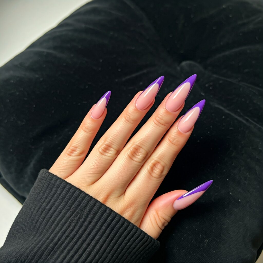 Purple french manicure on stiletto shaped nails