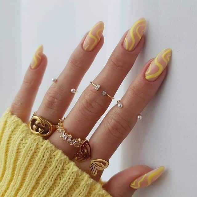 Yellow squiggle nails