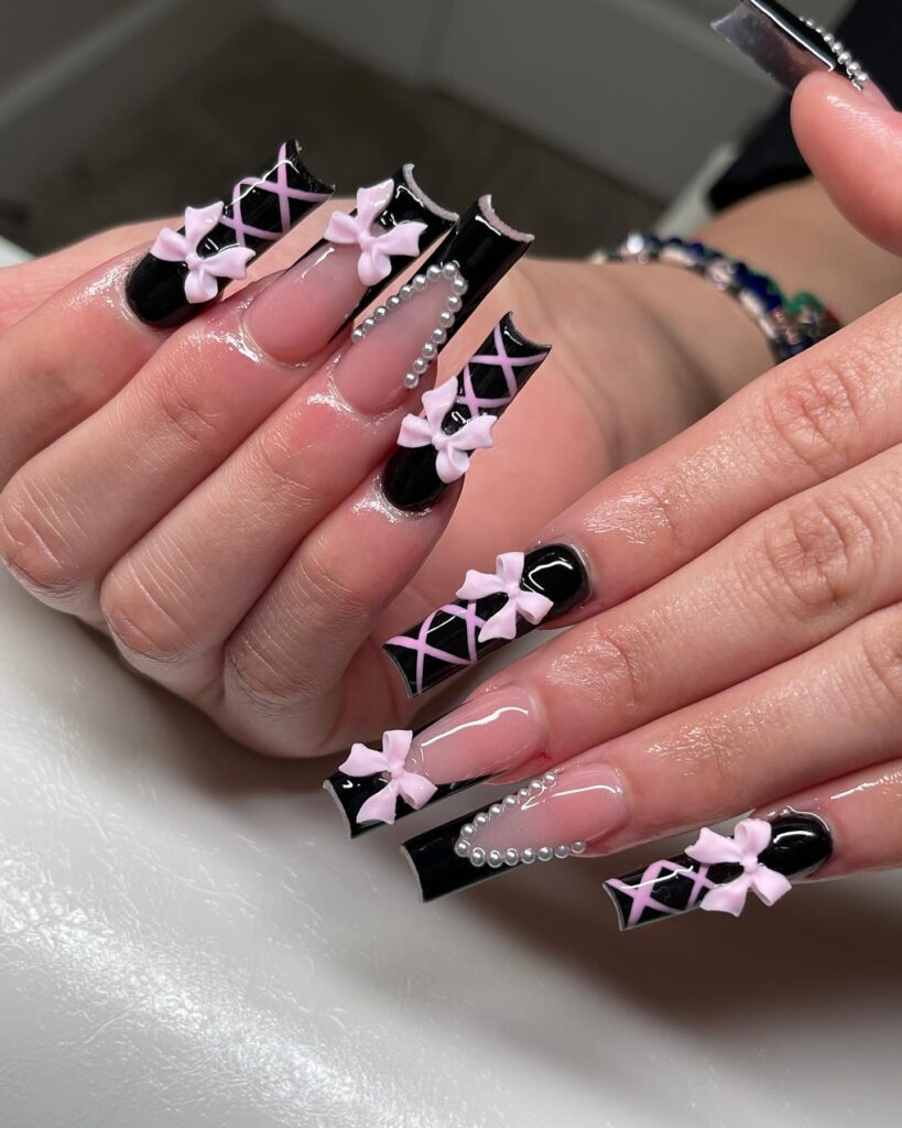 Crisscross nail art on acrylic nails with 3d bow accent