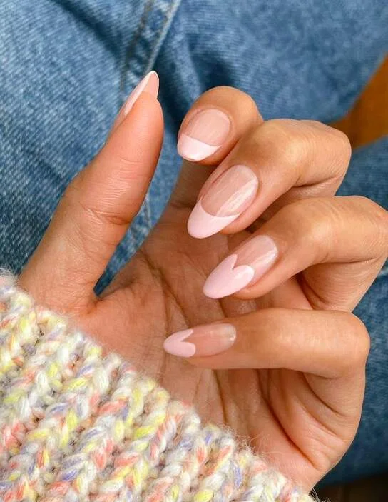 Light pink heart french tip nail idea