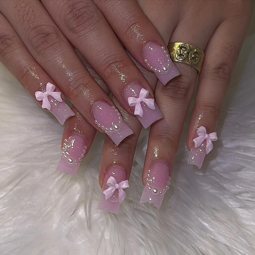 3D bow nail art in pink color