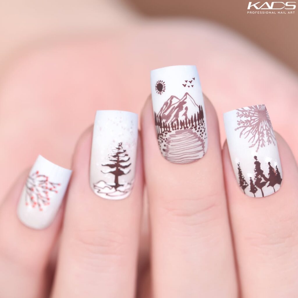 Pink nails with white snow-capped mountain designs